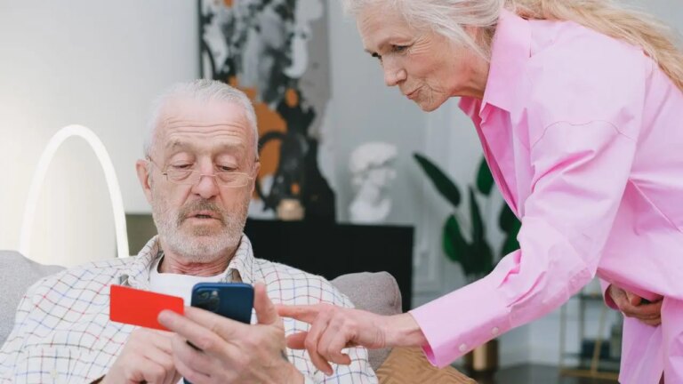 3-OLD-COUPLE-LOOKING-AT-PHONE.jpg