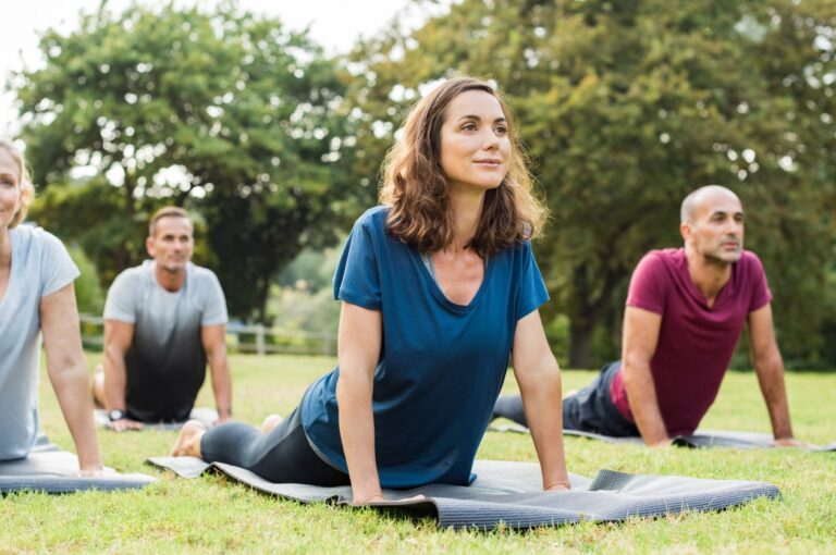 people-doing-yoga-in-park.jpg