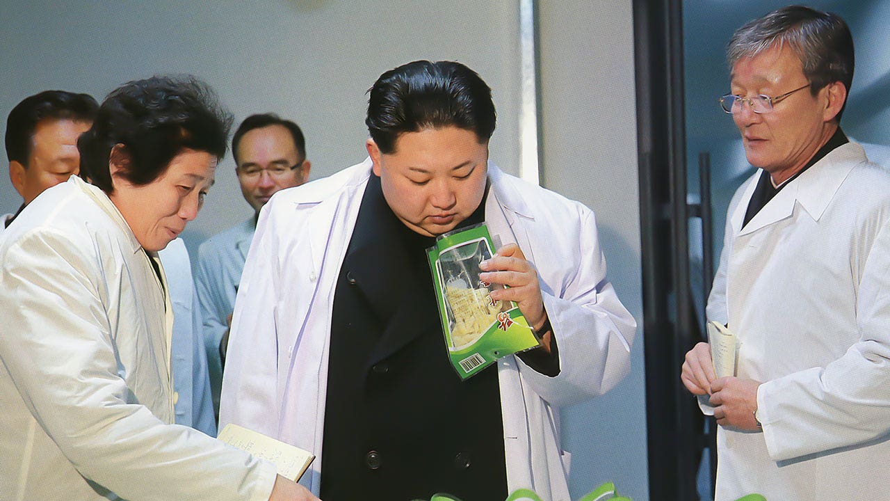 kim-jong-un-white-coat-black-outfit.jpg