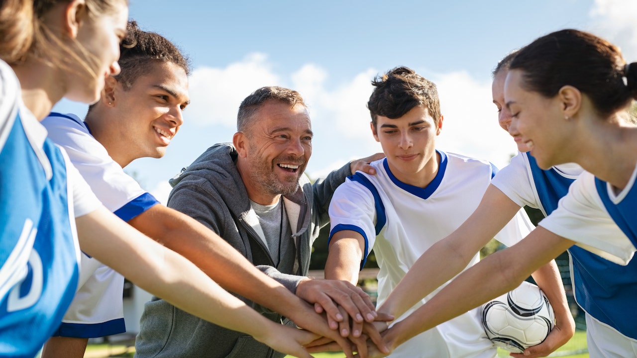 coach-with-teen-athletes.jpg