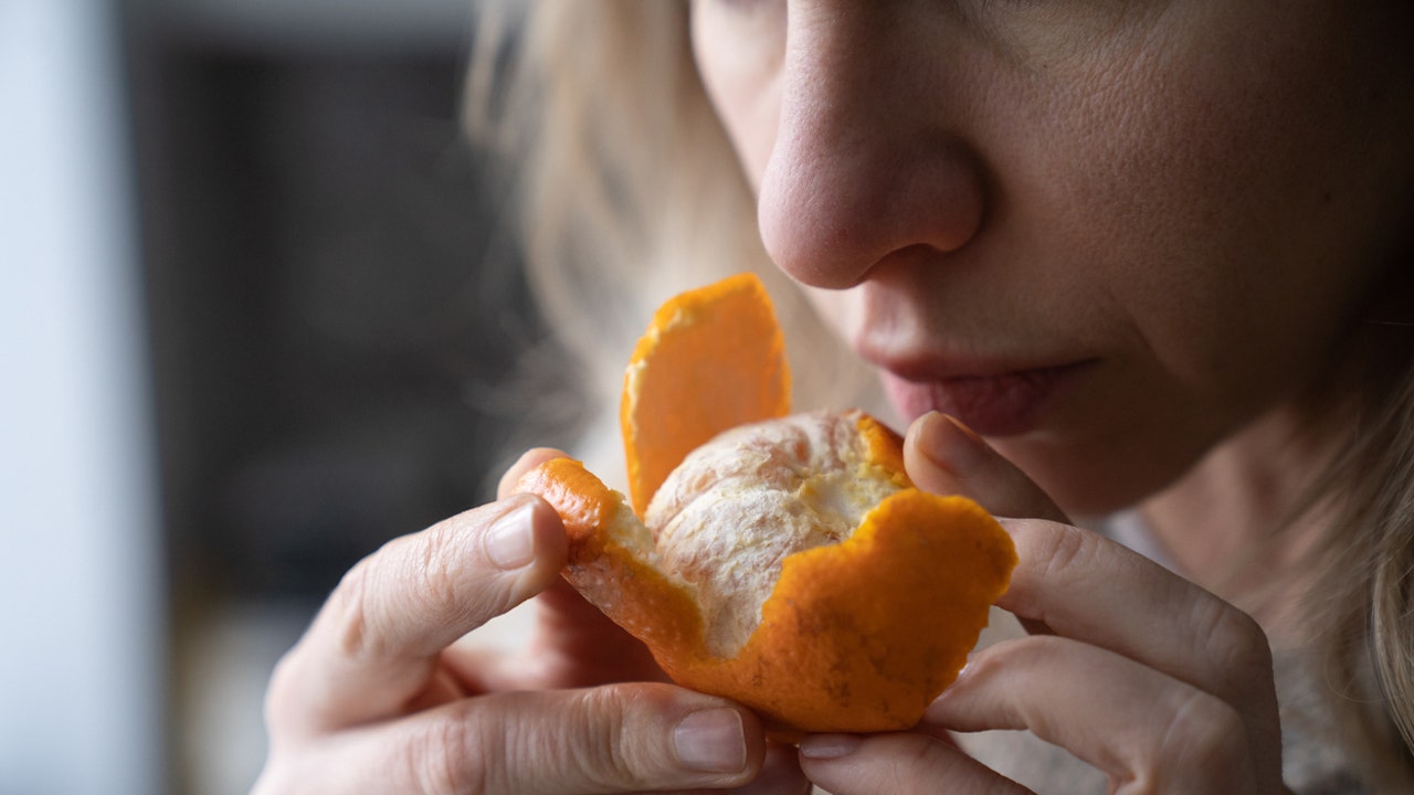 woman-smelling-orange.jpg