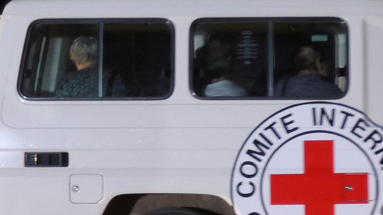 Israeli-Hostages-Red-Cross-Ambulances.jpg