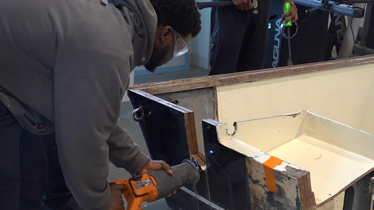 Students-at-Harbor-Corps-repair-damaged-boat.jpg