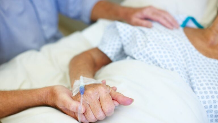 woman-hospital-holding-hands.jpg