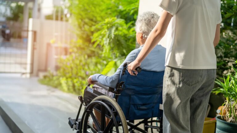 woman-pushed-wheelchair.jpg