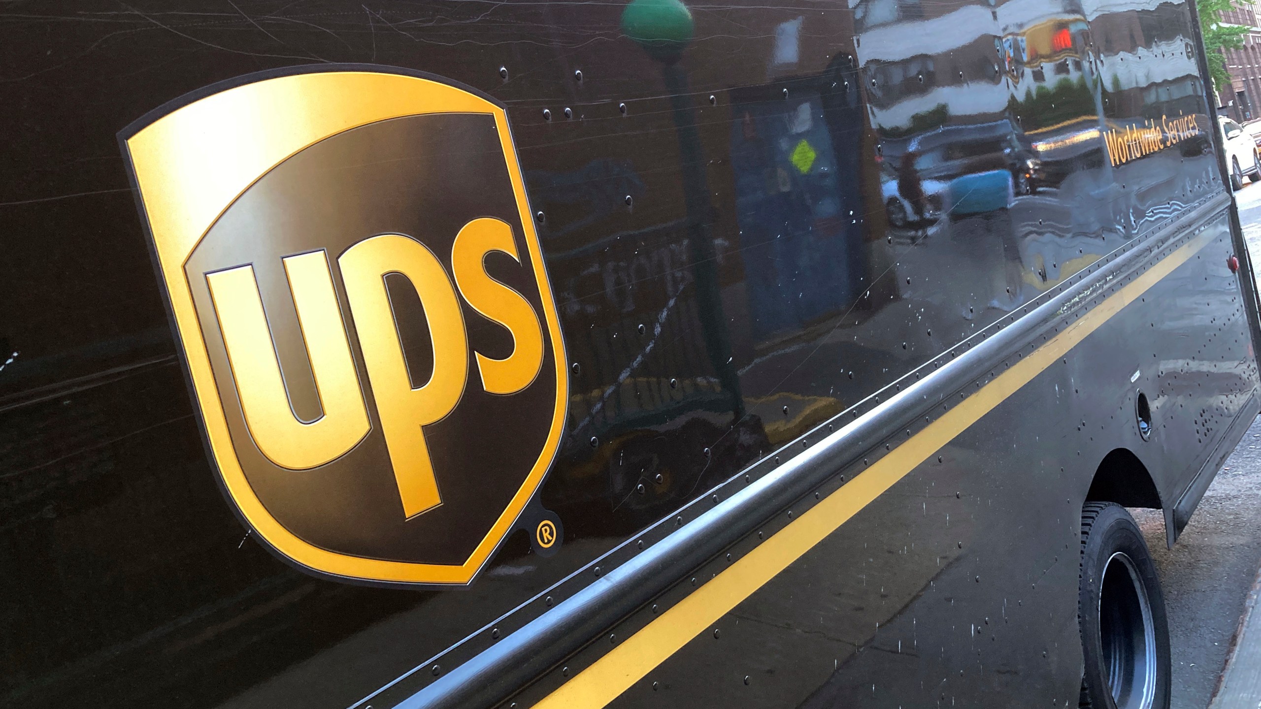 FILE - A United Parcel Service truck is parked on a street, in New York, Thursday, May 11, 2023. Shares of UPS are falling before the market open on Tuesday, Jan. 30, 2024, as the package delivery company gave a weaker-than-expected full-year revenue forecast. (AP Photo/Richard Drew, File)