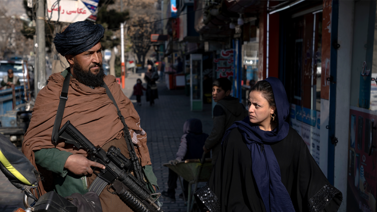 taliban-fighter-and-Afghan-woman.png