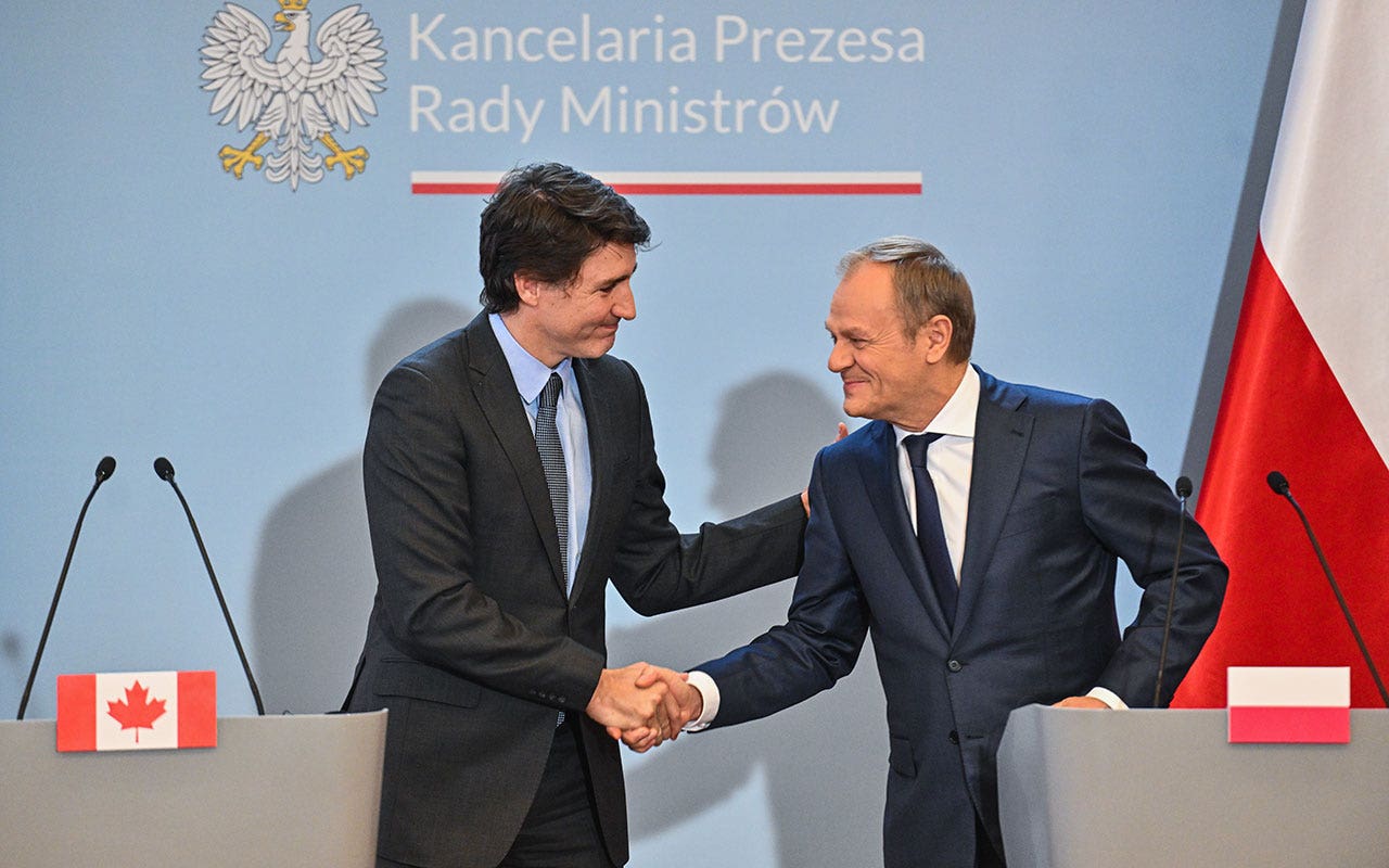 Donald-Tusk-Shakes-Hand.jpg