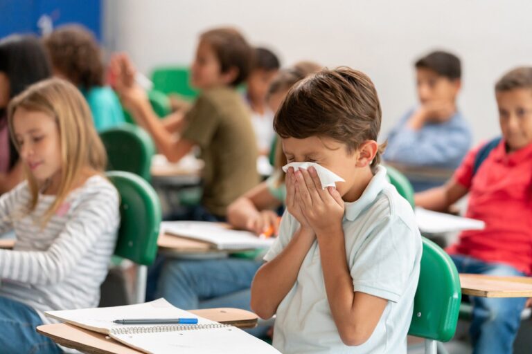 boy-blowing-nose-in-school.jpg