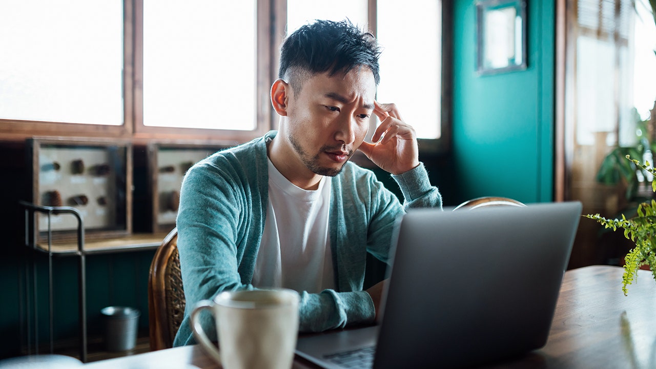 man-at-desk-with-coffee.jpg