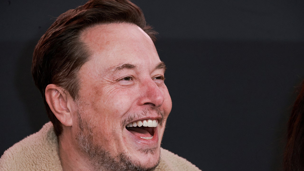 tesla-ceo-elon-musk-laugh.jpg