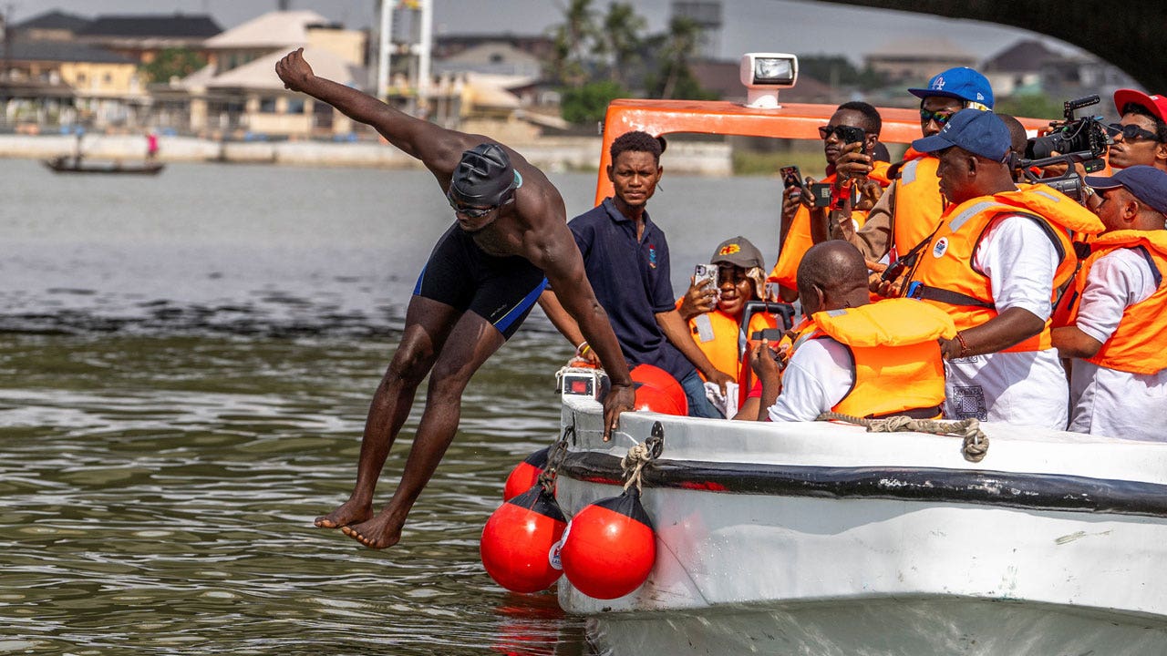 Akinrodoye-Samuel-jumps-into-the-water.jpg