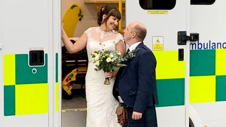 paramedics-marry-in-front-of-ambulance.jpg