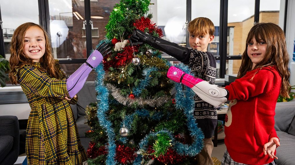 three-kids-with-bionic-arm.jpg