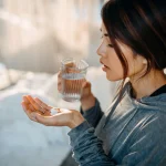 woman-holding-pills.jpg