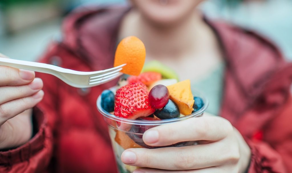 woman-eating-fruit-cup.jpg